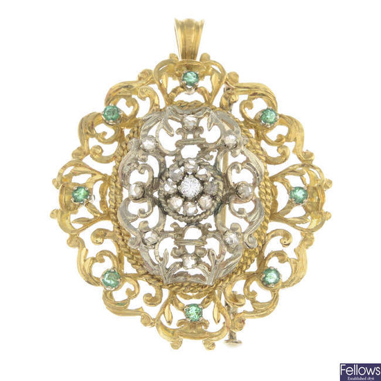 A diamond and emerald foliate pendant.