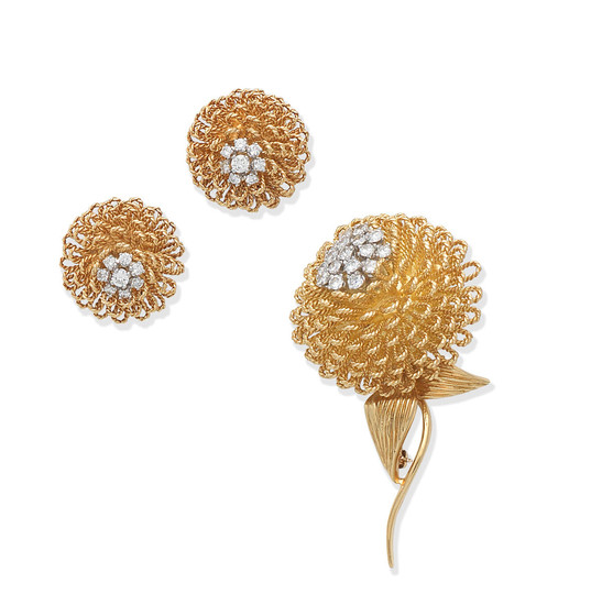 A diamond flower brooch and earclip suite