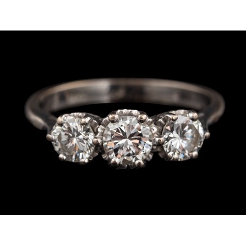 A diamond three stone ring,: set with three brilliant cut di...