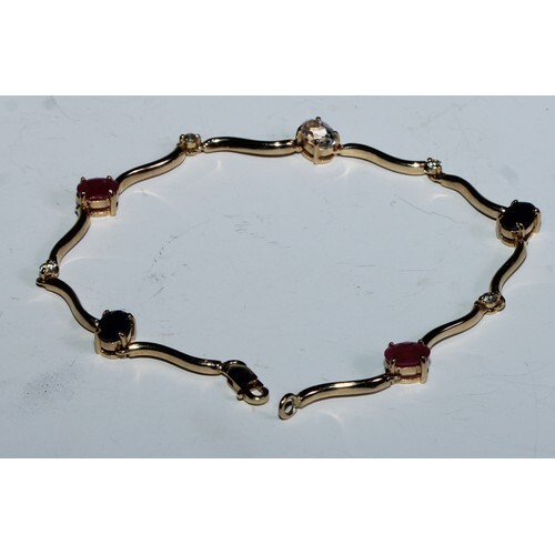 A fancy link ruby, sapphire and diamond bracelet, shaped wav...