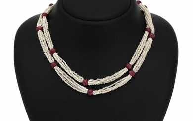 NOT SOLD. A five-strand keshi pearl and ruby necklace set with numerous keshi pearls, numerous...