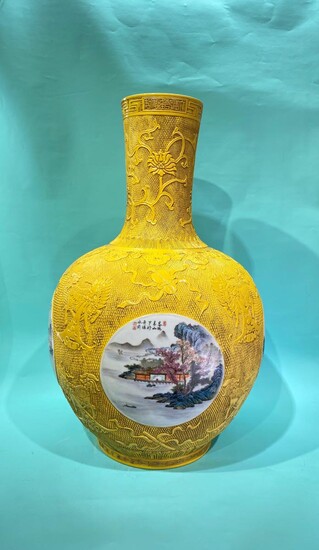A gigantic Chinese yellow carved porcelain vase with four...