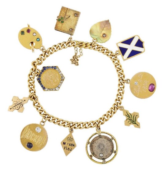 A gold curb-link charm bracelet suspending various...