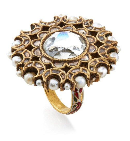 A gold mirror ring, India, 19th century, of floral shape inlaid with mirror and diamonds, the reverse with enamelled floral decoration in red, blue green and white and the circumference strung with pearls, ring size O, 3.4cm. diam., weight 26 grams