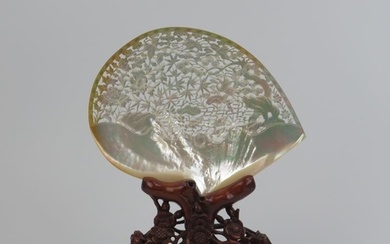A large Chinese carved and pierced mother of pearl shell mou...