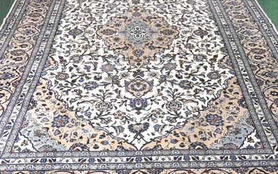 A large Persian Kashan carpet, with all over scrolling foliate...