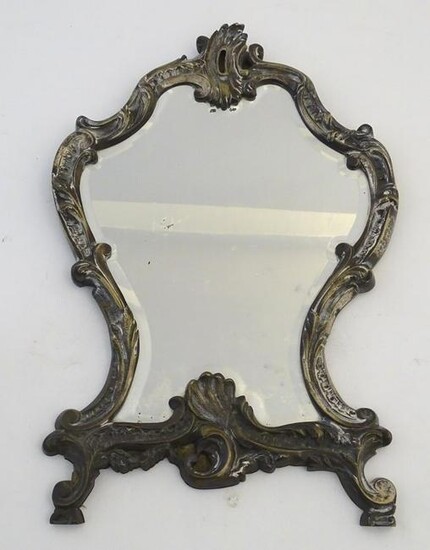 A late 19thC cast brass mirror with acanthus and C