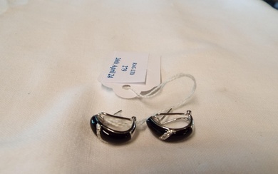 A pair of 14K white gold earrings inset with black onyx and ...
