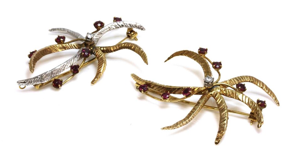 A pair of 9ct two colour gold, diamond and ruby star/flower brooches, c.1970