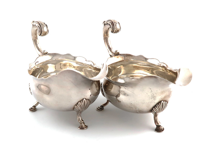 A pair of George III silver sauce boats