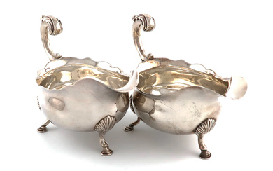 A pair of George III silver sauce boats