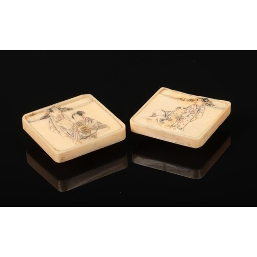 A pair of Japanese Meiji period carved ivory square formed b...