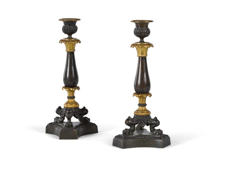 A pair of Louis-Philippe gilt and patinated bronze candlesticks, mid-19th century