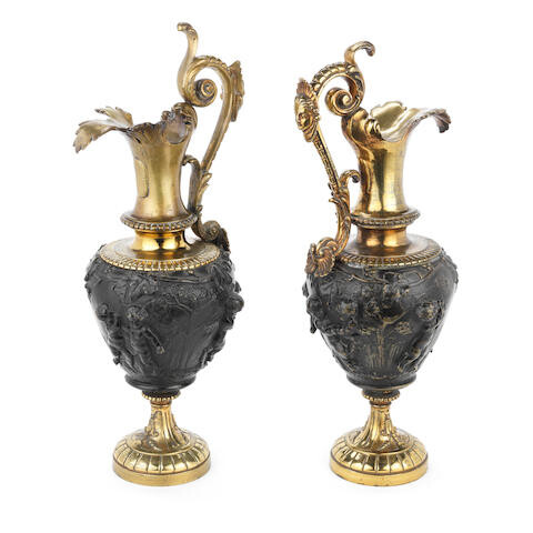 A pair of late 19th century gilt and patinated bronze garniture ewers