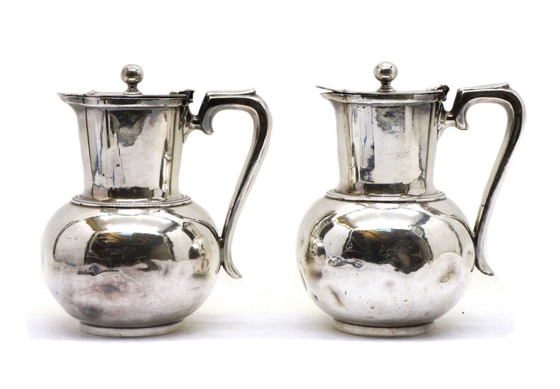 A pair silver plated hot water jugs