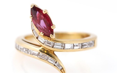 A ruby ring set with a marquise-cut ruby flanked by numerous trapeze...