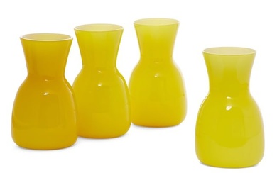 A set of four Venini yellow glass vases