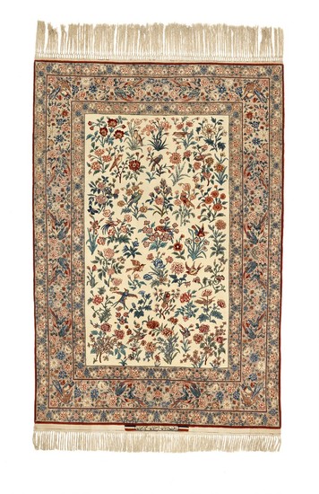 A signed Seirafian Isfahan rug, Persia. All over design of roses and bird motifs on an ivory field. C. 1960. 220×148 cm.
