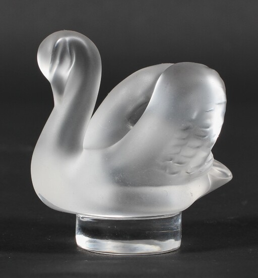 A small Lalique model of a frosted glass swan, on circular base etched 'Lalique/France'