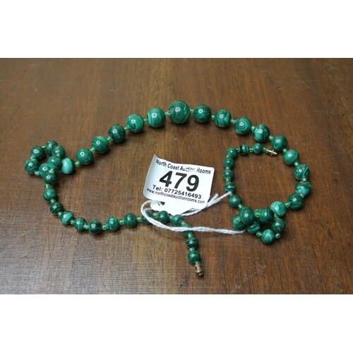 A stunning antique Chinese green jade beaded necklace.