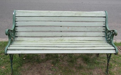 A two seat garden bench with painted wooden slatted seat rai...