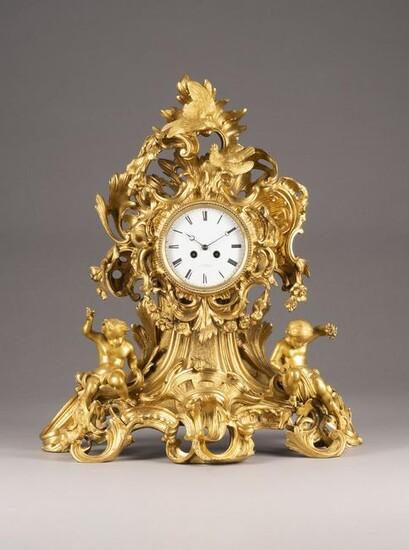 AN IMPORTANT AND VERY LARGE ORMOLU CLOCK WITH PUTTI