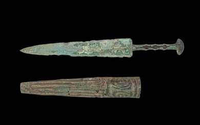 ANCIENT BRONZE SWORD WITH A DECORATED SCABBARD