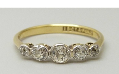 An 18ct gold and five stone diamond ring, all stones old cut...