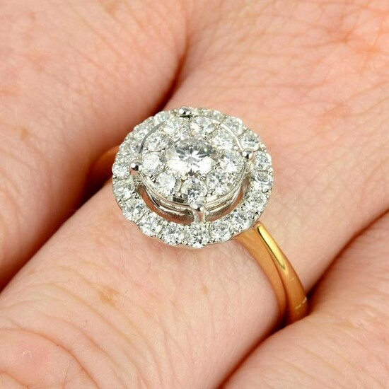 An 18ct gold brilliant-cut diamond cluster ring.Total