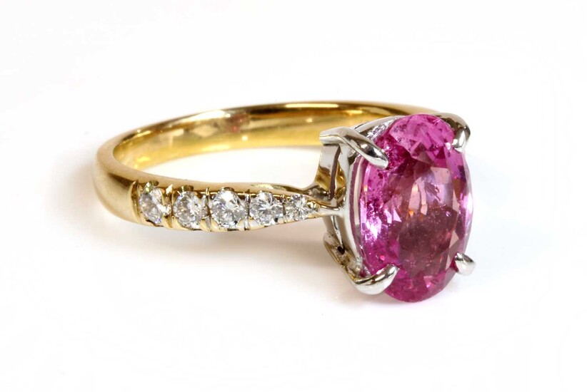 An 18ct gold pink sapphire and diamond ring