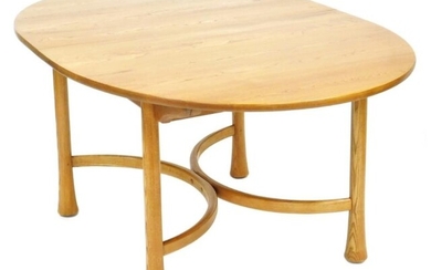 An Ercol elm draw leaf dining table, the oval...