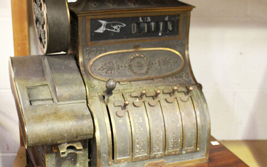 An early 20th century cast brass National cash register, the case bearing cast serial number '1