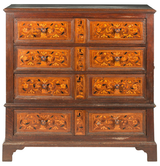 An oak and floral marquetry inlaid chest of drawers