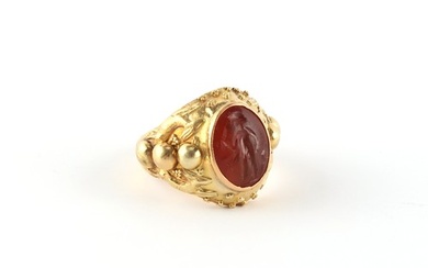 An unmarked high carat yellow gold ring set with an antique ...
