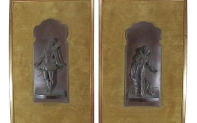 Antique European pair of carved wood plaques