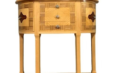 Art Deco style half moon chest of drawers in noble wood marquetry on light wood background
