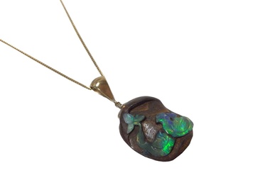 Carved black opal pendant on chain