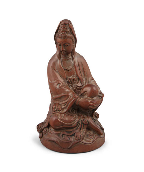 Description A CHINESE CARVED BOXWOOD FIGURE OF A SEATED...