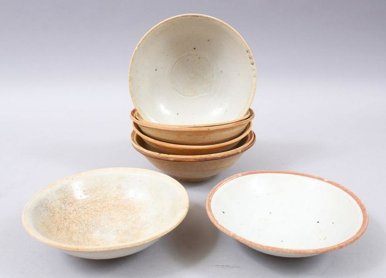 EIGHT EARLY CHINESE POTTERY GLAZED BOWLS, some glazed