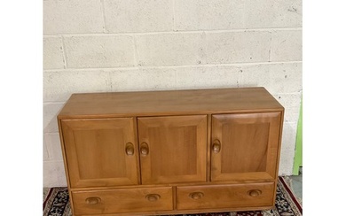 Ercol light elm sideboard, three doors above two drawers on ...