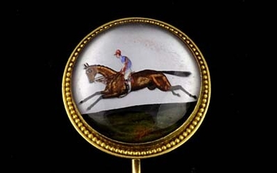Essex Crystal Tie/Stick Pin reverse intaglio carved with the image of a flat racer at full gallop with jockey up in 15ct gold mounting. Diameter 2 cm.