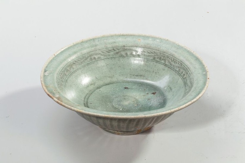 Glazed terra cotta bowl with celadon decoration with...