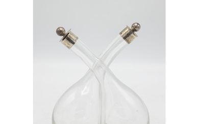 Hand blown glass oil and vinegar bottle with silver top fini...