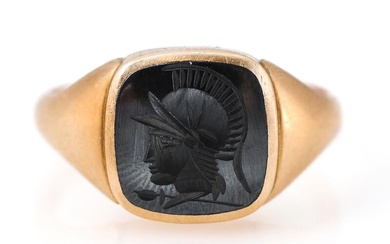 Hematite ring set with carved hematite intaglio, mounted in 14k gold. Front...
