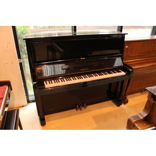 Markson (c1995) A 130cm upright piano in a bright ebonised c...