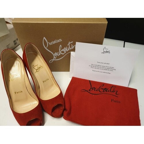 Pair of Louboutin red high heeled court shoes with open toes...