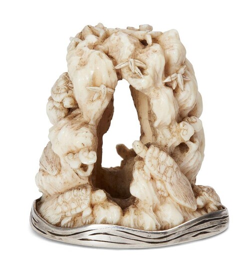 Property of a Gentleman (lots 36-85) A Japanese Ivory and Silver Netsuke by Rakumin, 19th century, carved finely as turtles clambering over a rock formation, signed Raumin in metal cartouche to base, 4.5cm high
