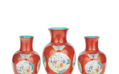 THREE CORAL-GROUND AND GILT-DECORATED FAMILLE ROSE VASES Jiaqing to Daoguang,...