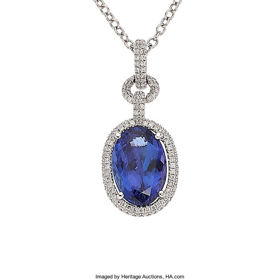Tanzanite, Diamond, White Gold Pendant-Necklace The pendant features...