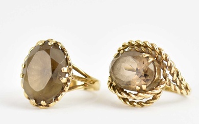 Two 9ct gold dress rings, both claw set with oval...